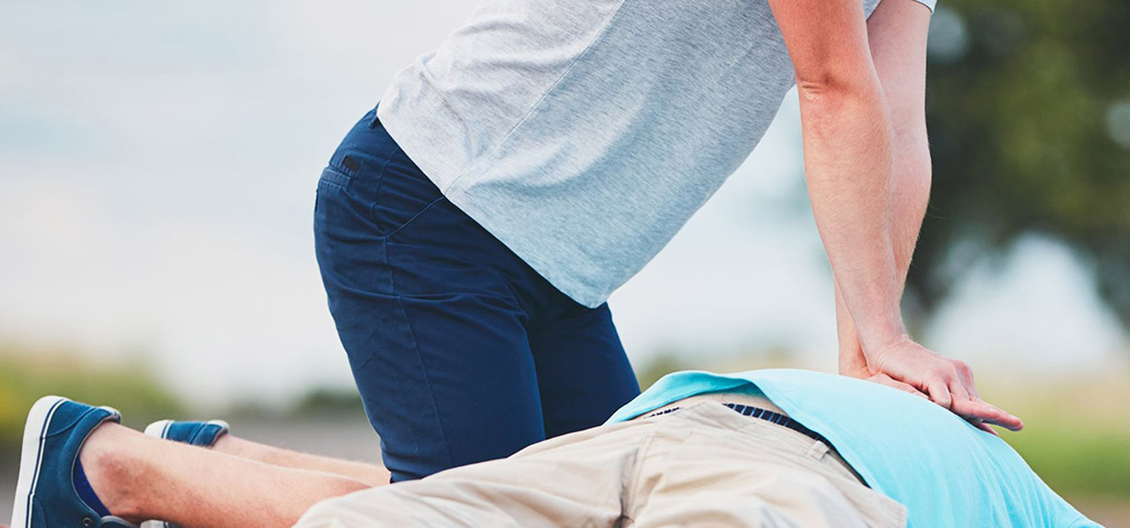 Man doing cpr on someone.