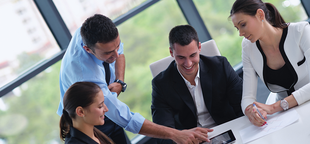 Group of working colleagues having a discussion.